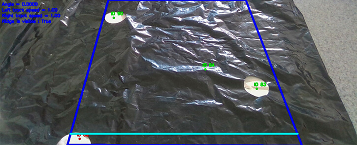 Integra Sources specialists prepared photo and video materials for teaching the system to recognize plant holes in a bed covered with landscape fabric.